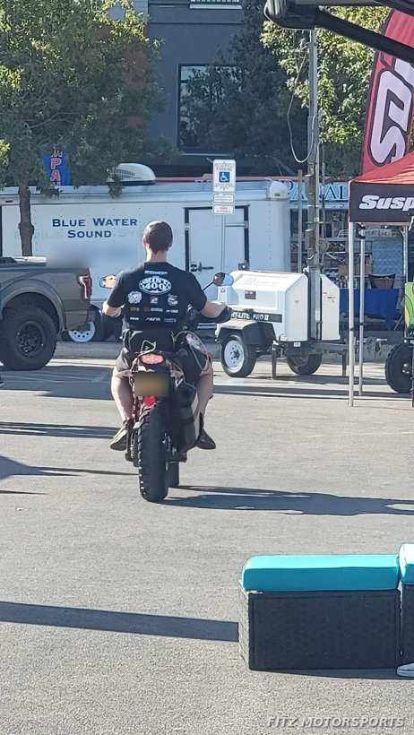 Rider in a Mint 400 team shirt leaving on the KTM