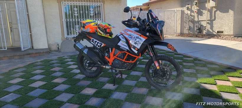 The KTM 1290, number 113, parked and ready