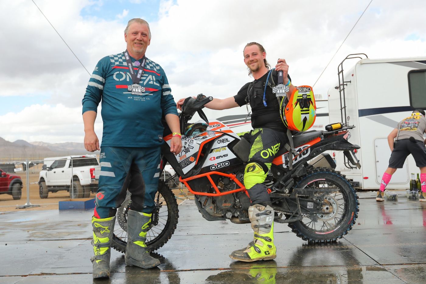 Holding the Mint 400 finisher medal next to the bike