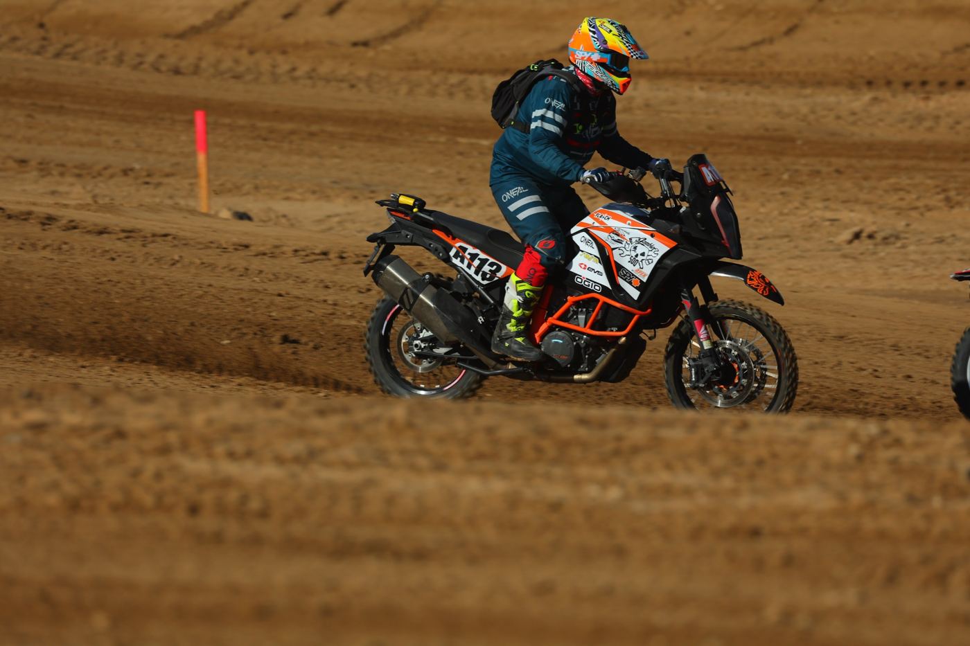 Side view of A113 carving through soft dirt