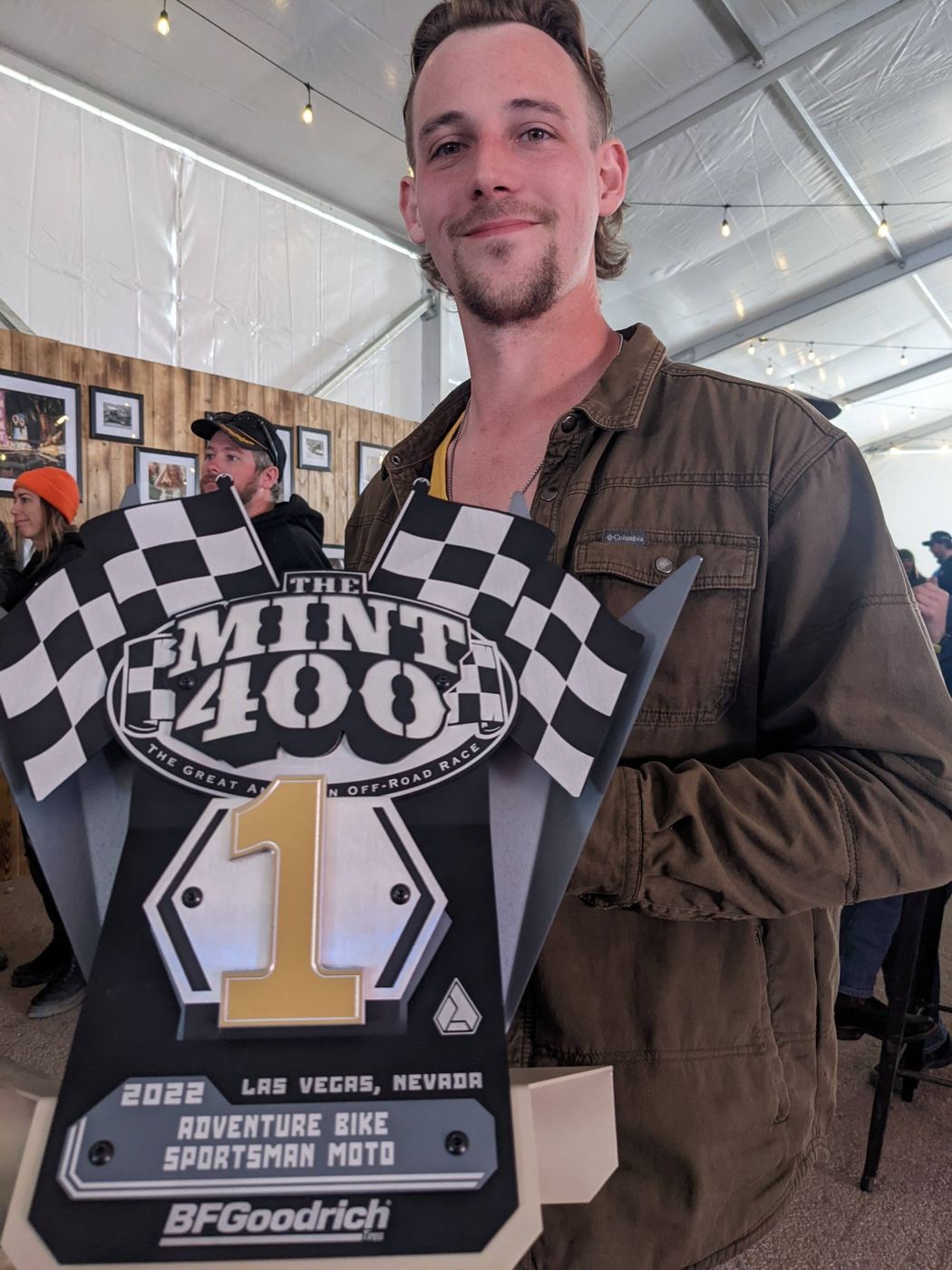Holding the 1st place Mint 400 trophy for Adventure Bike Sportsman Moto